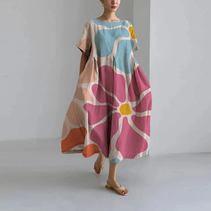 Loose midi dress with oversized pink and blue floral print, short sleeves, casual summer dress