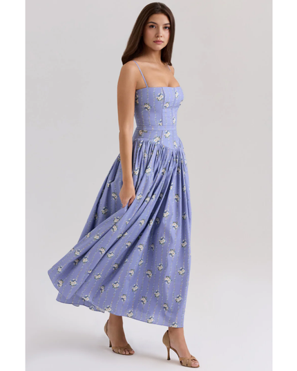 Side view of lavender floral summer dress with fitted waist and flowing midi length