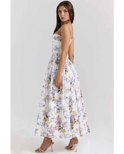 Side view of a women's floral maxi dress showing a fitted waist and flowing summer dress skirt