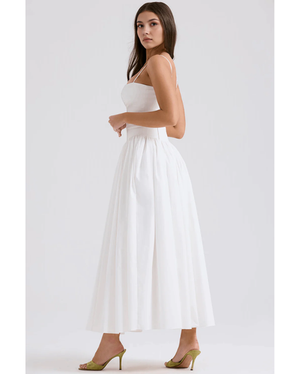 Back side view of white maxi dress with straps, open back, and flowing skirt