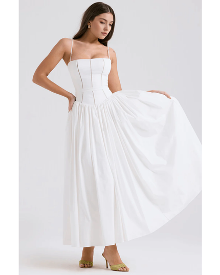 White summer maxi dress with square neckline and full skirt held out to the side