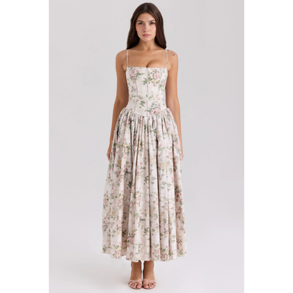 Front view of floral maxi dress with thin straps, corset-style bodice, and gathered skirt