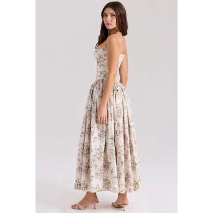 Side view of floral summer dress showing fitted waist and voluminous maxi skirt