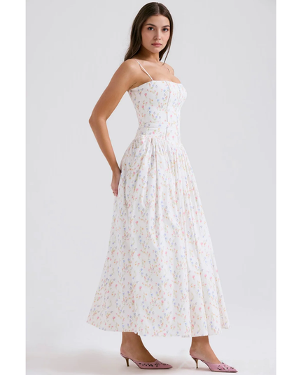 Side profile of white floral summer dress with corset bodice and ankle-length hem