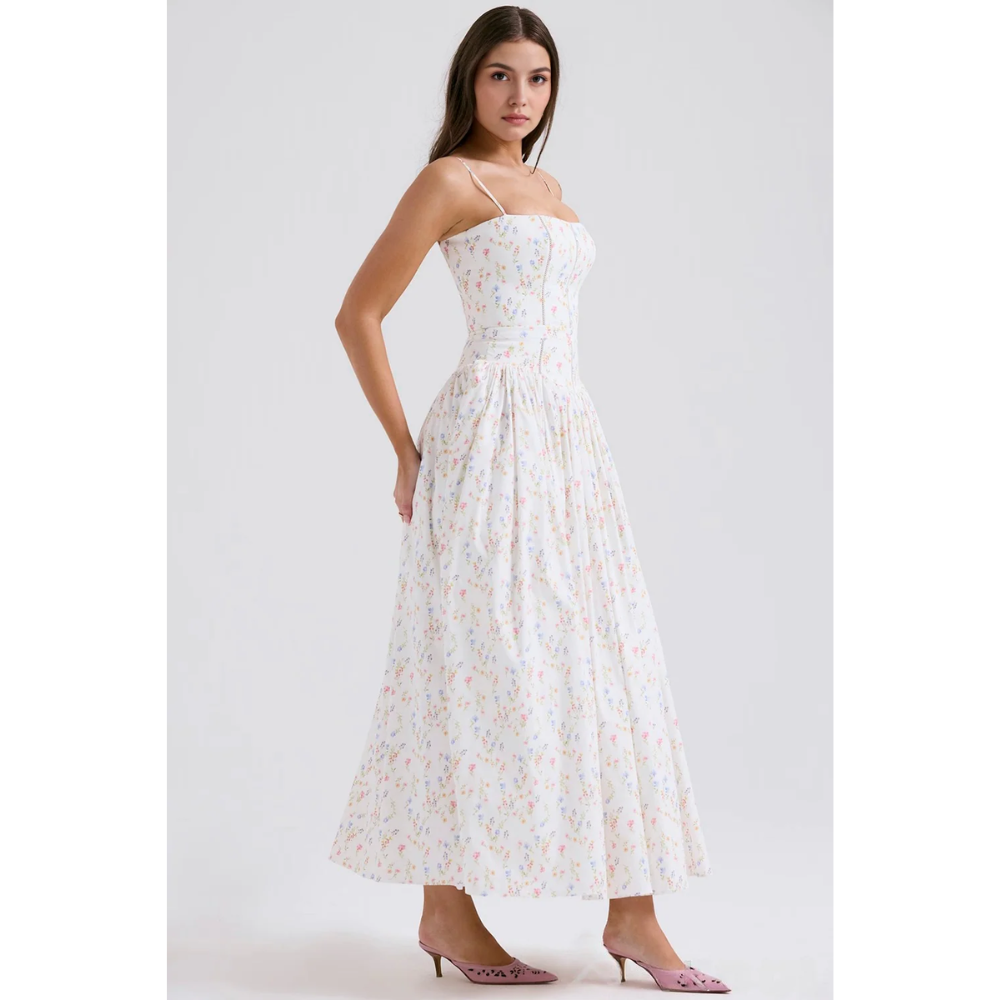 Side profile of white floral summer dress with corset bodice and ankle-length hem