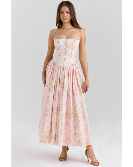 Close-up of women's floral maxi dress bodice with straight neckline, thin straps, and corset seams