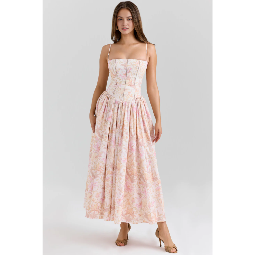 Close-up of women's floral maxi dress bodice with straight neckline, thin straps, and corset seams