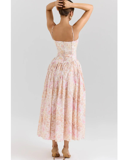 Side view of pastel floral summer dress with fitted bodice and full midi length skirt