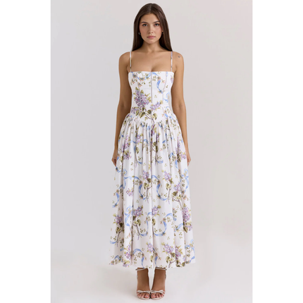 Women's floral maxi dress with spaghetti straps, fitted bodice, and full skirt in white