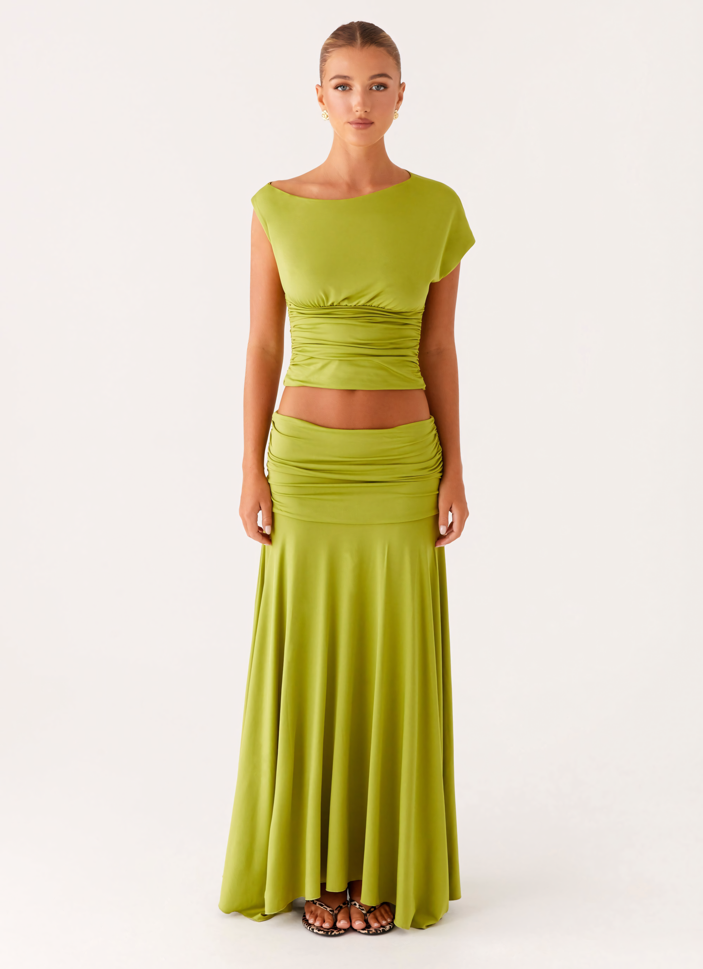 Front full-length view of lime green summer dress with boat neck, ruched bodice, and long skirt