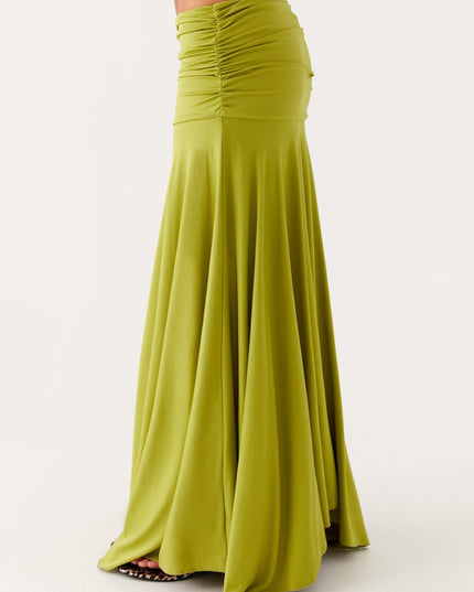 Close-up side view of lime green ruched waist maxi dress with smooth boat neck neckline