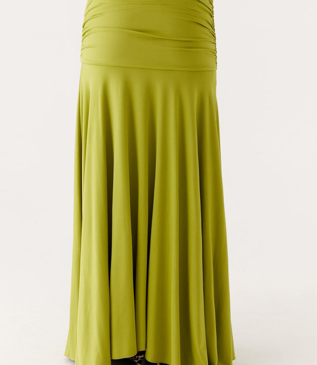 Back close-up of lime green maxi dress showing ruched waist panel and flowing skirt fabric