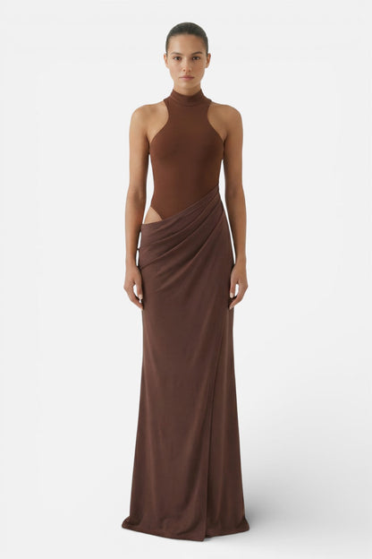 Front view of brown halter cut out maxi dress with fitted bodice and long skirt