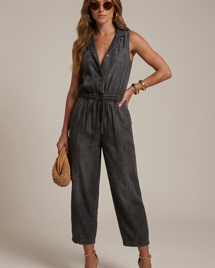 Dark charcoal sleeveless denim romper with pockets, drawstring waist, and cropped legs