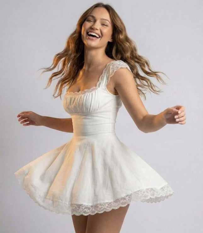 White summer dress with fitted waist, flared skirt, and delicate lace trim shown in motion