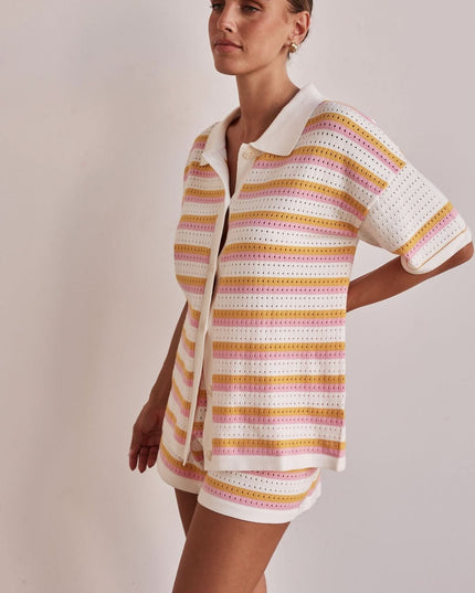 Side view of striped collared knit shirt and matching shorts set for women