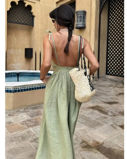 Back view of sage green linen maxi dress with open back and tie shoulder straps