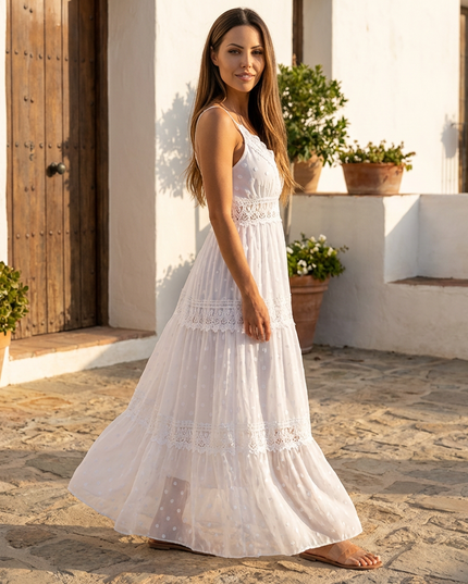 Side view of white maxi dress with lace panels and sheer floral fabric in a summer dress style