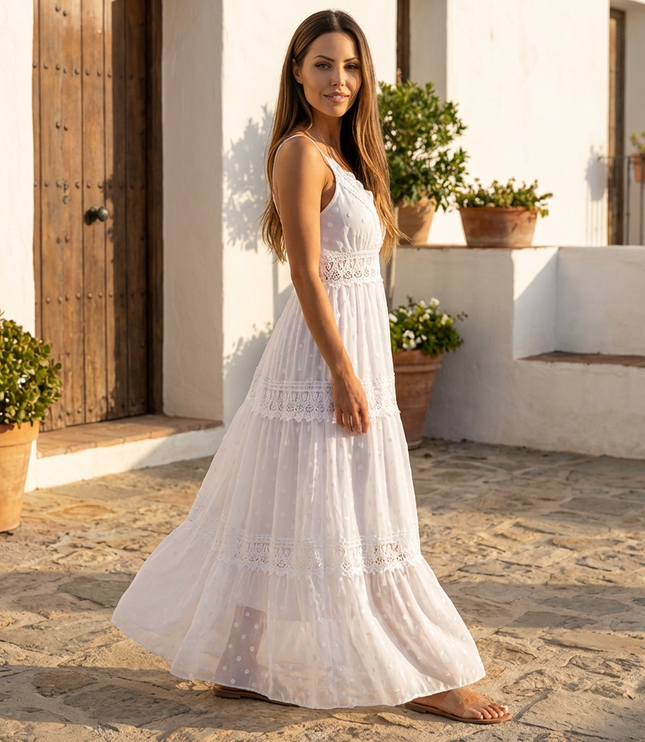 Side view of white maxi dress with lace panels and sheer floral fabric in a summer dress style
