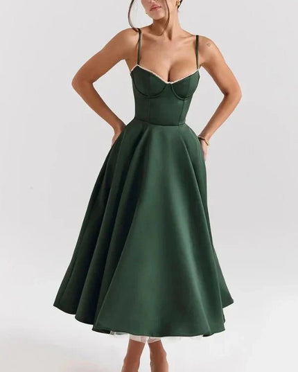 Front view of dark green midi dress with fitted bodice and flared skirt for a wedding guest look