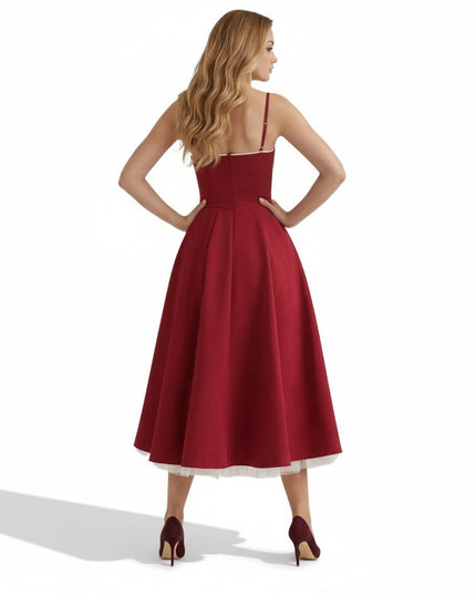 Back view of a burgundy midi dress with open back, fitted waist, and full skirt