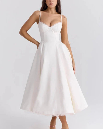 White midi dress with fitted bodice and full skirt for wedding guest