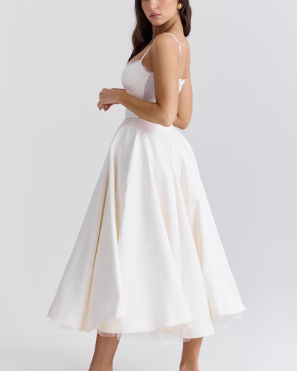 Side view of white midi dress with open back and flared skirt