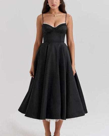 Black midi dress with corset bodice and full skirt for wedding guest