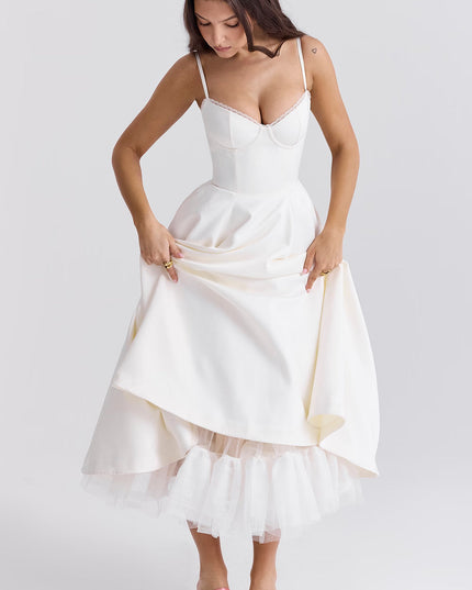 White midi dress with gathered skirt and tulle hem for wedding guest