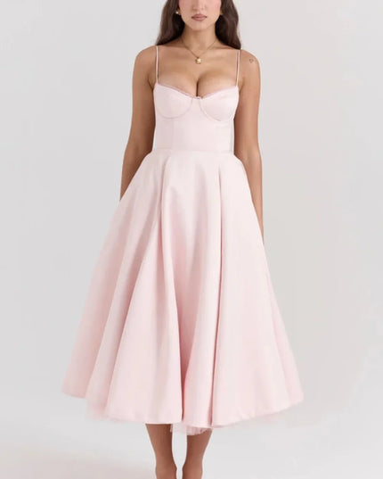Blush pink midi dress with spaghetti straps and full skirt for wedding guest