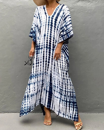 Blue and white tie dye maxi dress with V-neck, loose sleeves, and flowing hem