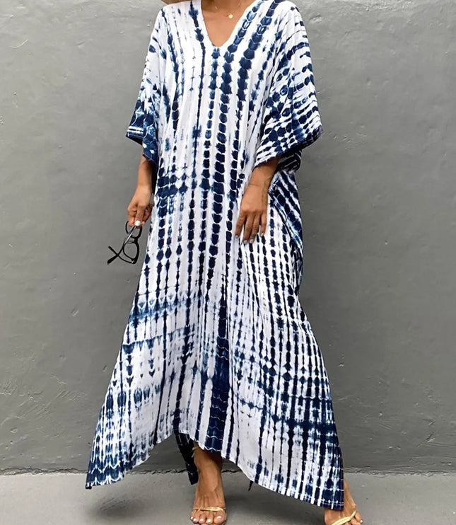 Blue and white tie dye maxi dress with V-neck, loose sleeves, and flowing hem