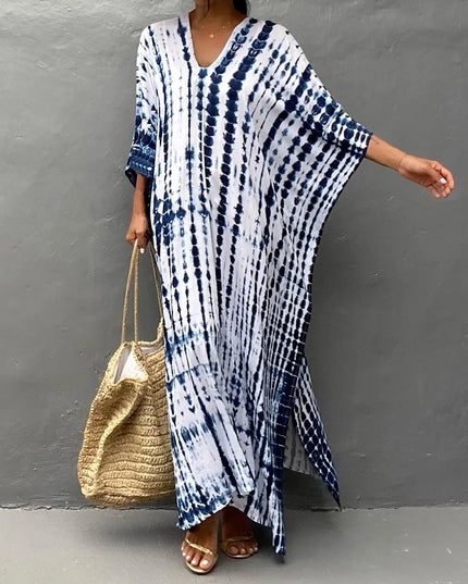 Blue and white tie dye summer dress with V-neck, wide sleeves, and side slit