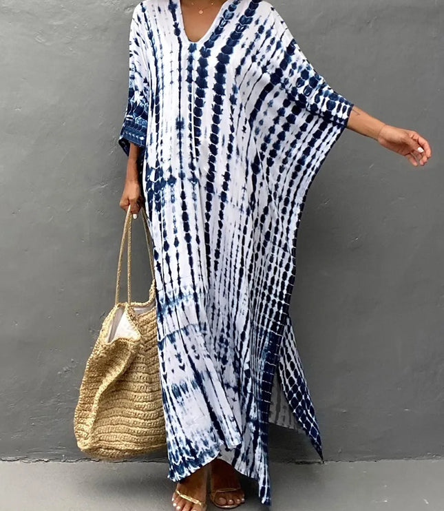Blue and white tie dye summer dress with V-neck, wide sleeves, and side slit