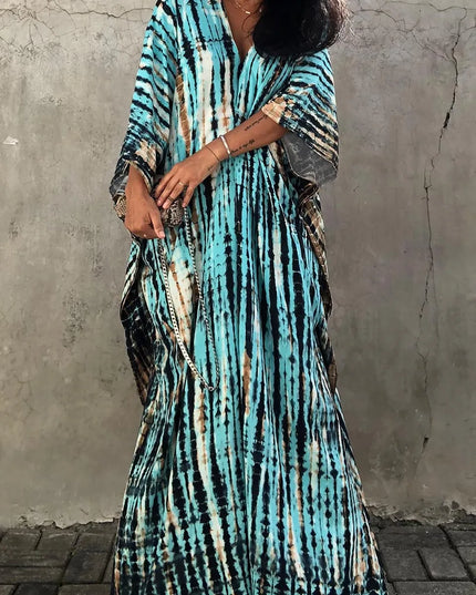 Turquoise tie dye maxi dress with V-neck, relaxed fit, and draped short sleeves