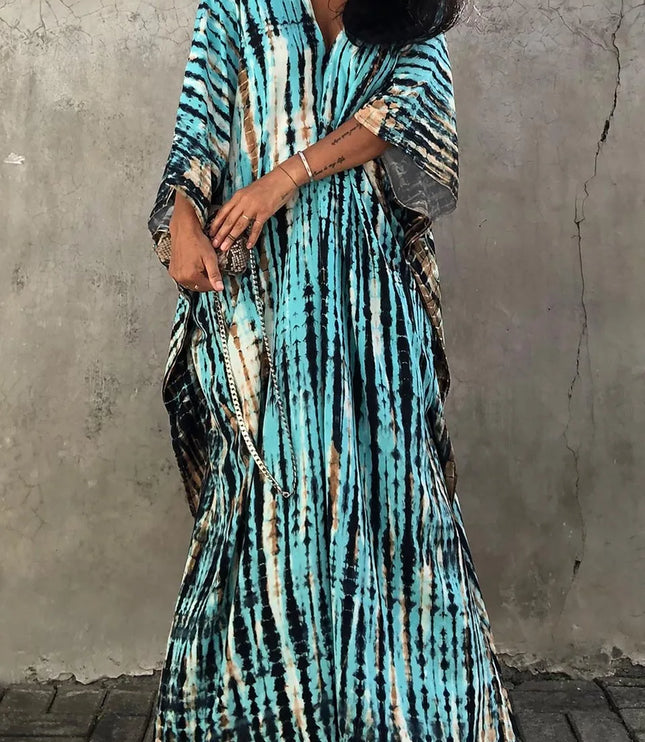 Turquoise tie dye maxi dress with V-neck, relaxed fit, and draped short sleeves