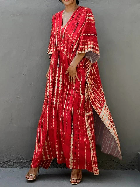 Red tie dye maxi dress with V-neck and draped wide sleeves for a breezy summer dress look