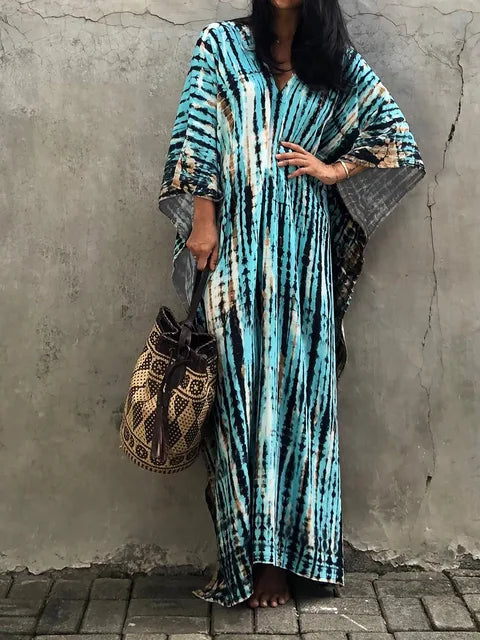 Turquoise tie dye maxi dress with oversized sleeves and long flowing hem for beach summer wear