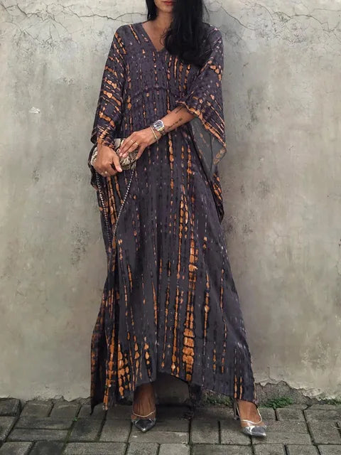 Dark charcoal tie dye maxi dress with orange streaks, V-neck, and relaxed boho summer dress style