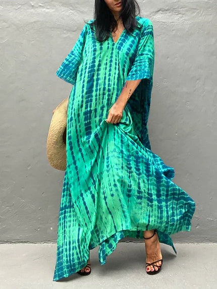 Teal and green tie dye maxi dress with loose sleeves and flowing summer dress silhouette