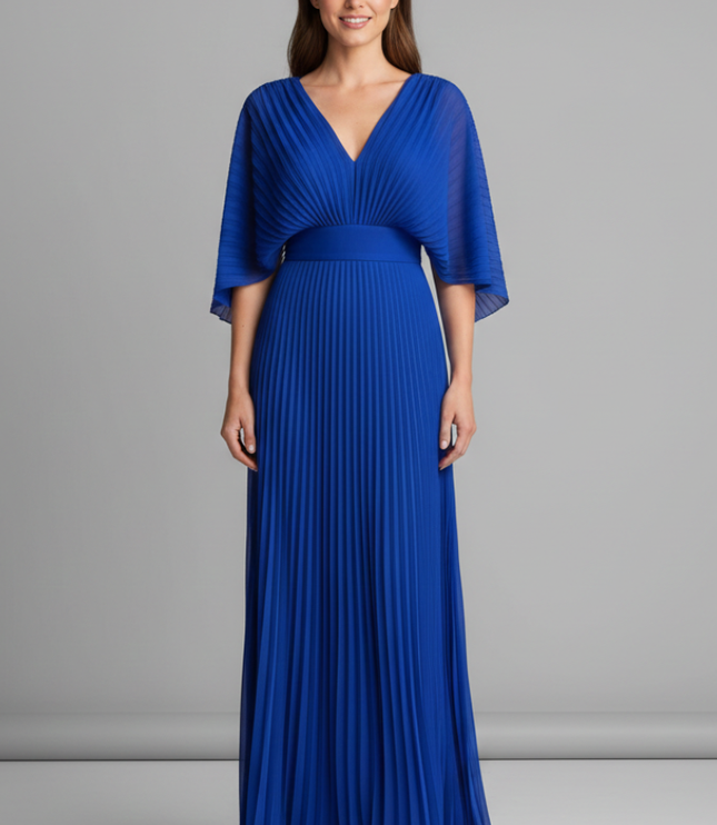 Front view of royal blue V neck pleated maxi dress worn with flowing sleeves