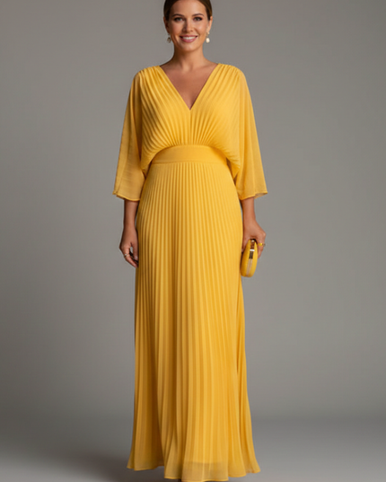 Dusty pink pleated maxi dress with V neck, elbow sleeves, and flowing skirt