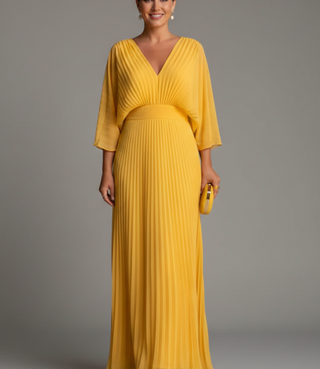Dusty pink pleated maxi dress with V neck, elbow sleeves, and flowing skirt