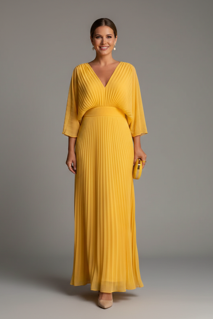 Dusty pink pleated maxi dress with V neck, elbow sleeves, and flowing skirt