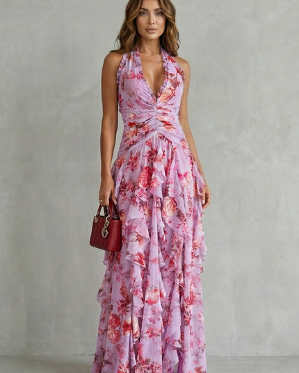 Front view of pink floral halter maxi dress with ruched waist and layered ruffles
