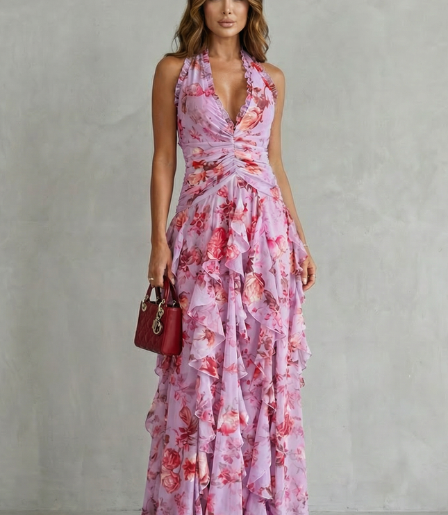 Front view of pink floral halter maxi dress with ruched waist and layered ruffles