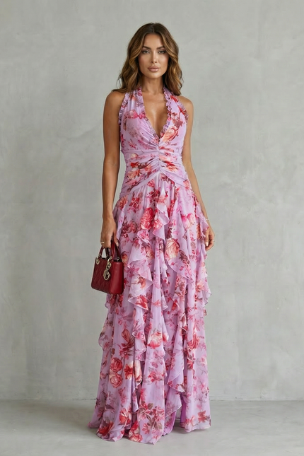 Front view of pink floral halter maxi dress with ruched waist and layered ruffles