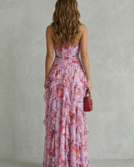 Back view of pink floral halter maxi dress with strapless back and tiered skirt