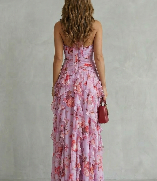 Back view of pink floral halter maxi dress with strapless back and tiered skirt