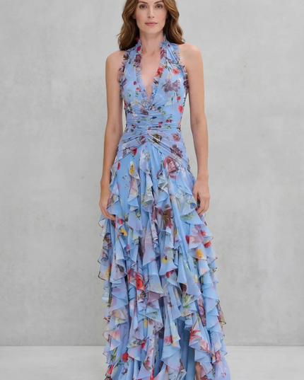 Front view of blue floral halter maxi dress with ruched waist and slit skirt
